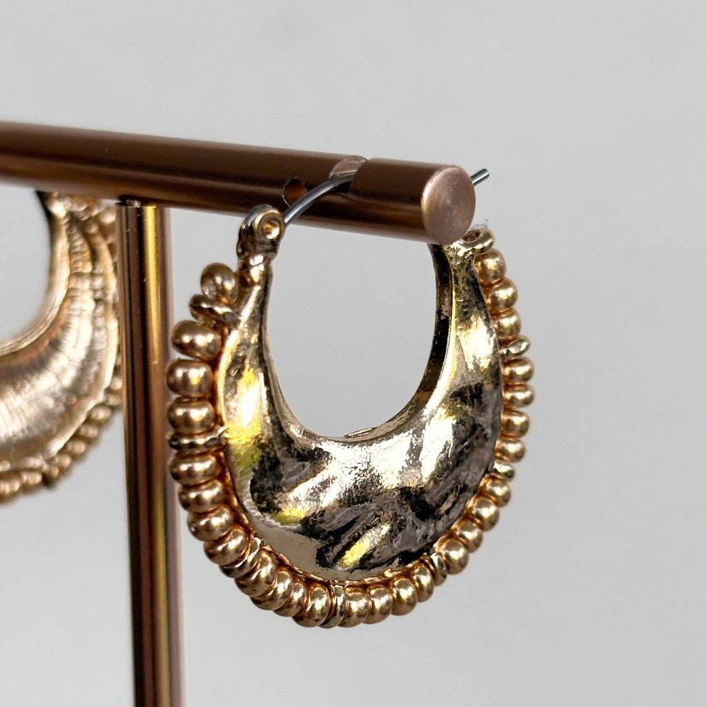 Hammered Gold Crescent Hoop Earrings with decorative fringed edge
