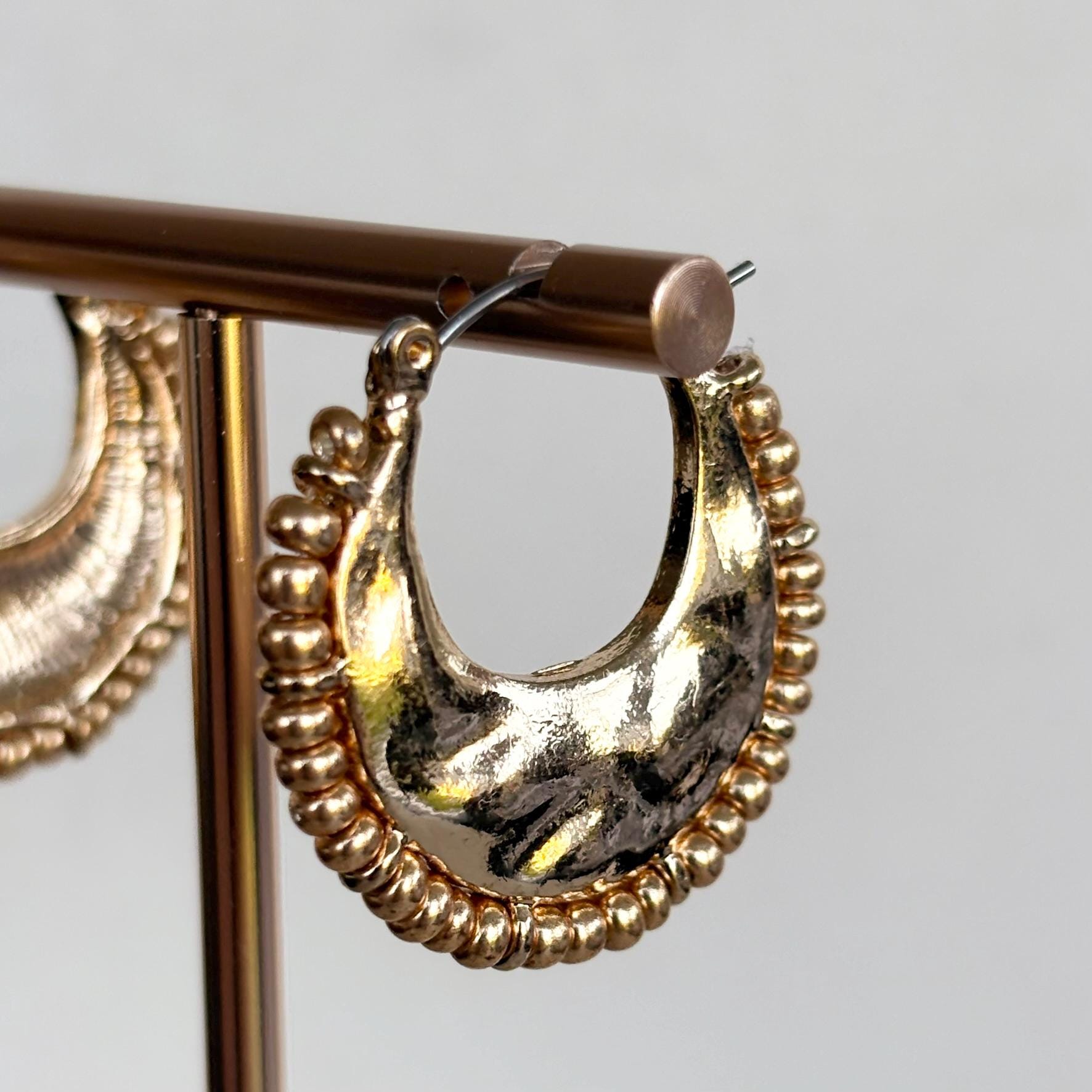 Hammered Gold Crescent Hoop Earrings with decorative fringed edge