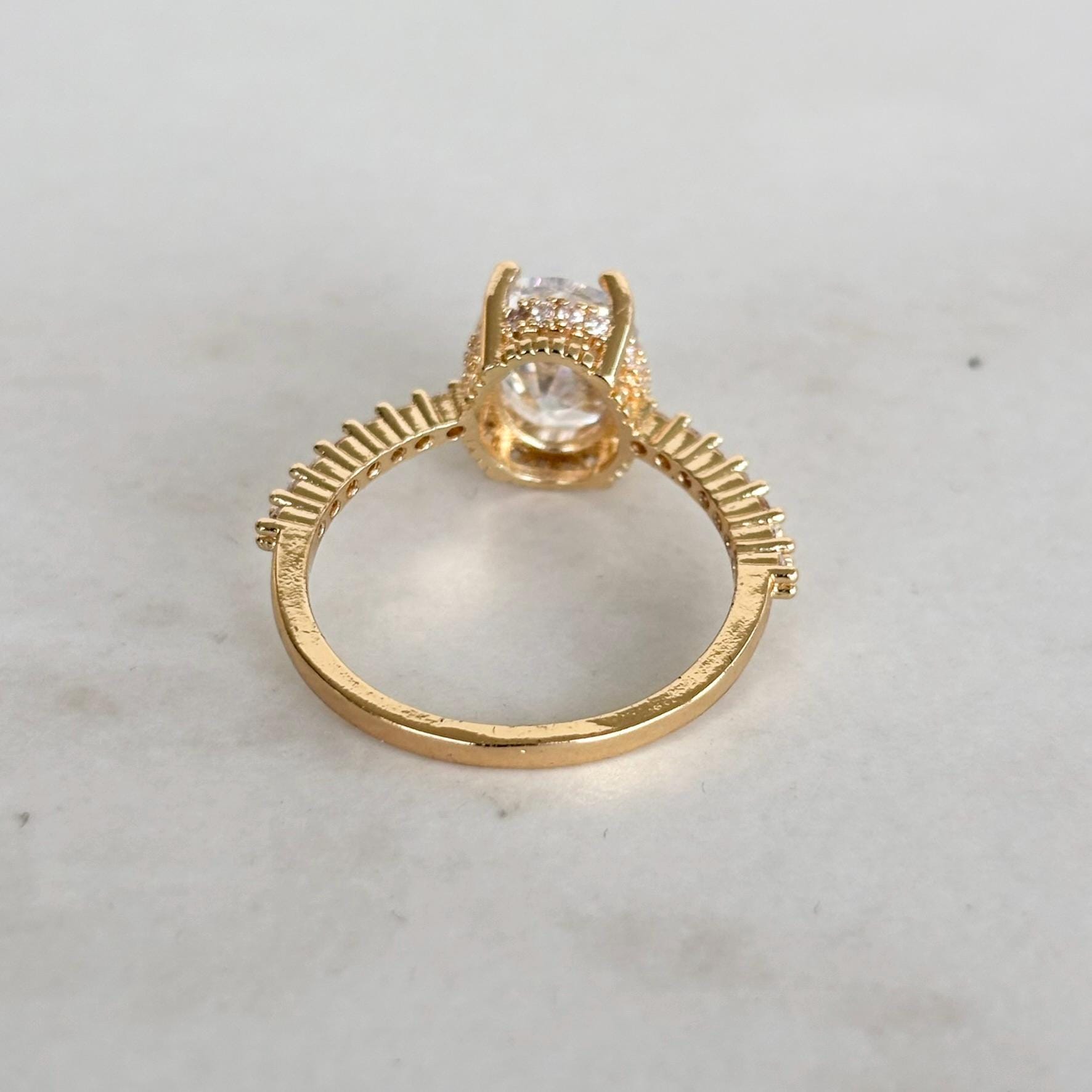 Gold Oval Zircon Solitaire Pave Shoulders Ring