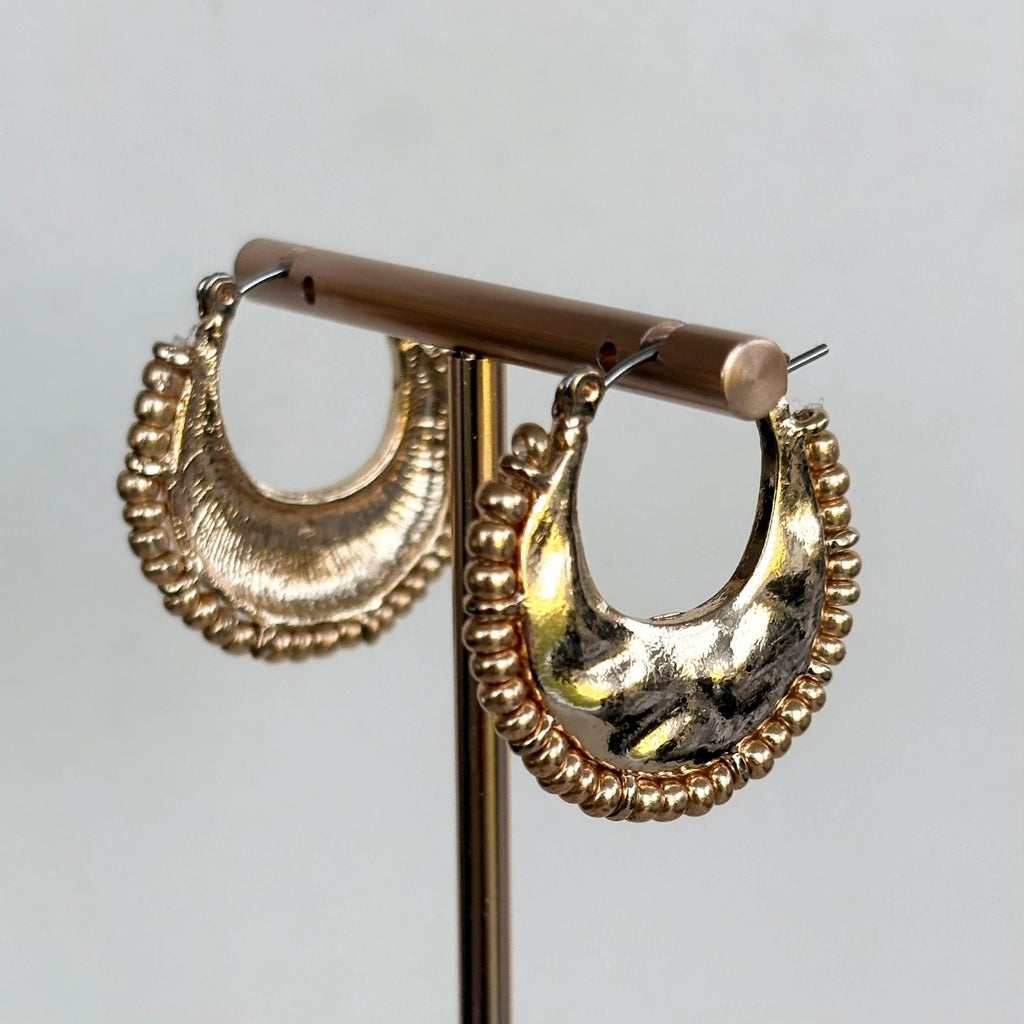 Hammered Gold Crescent Hoop Earrings with decorative fringed edge
