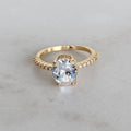 Gold Oval Zircon Solitaire Pave Shoulders Ring