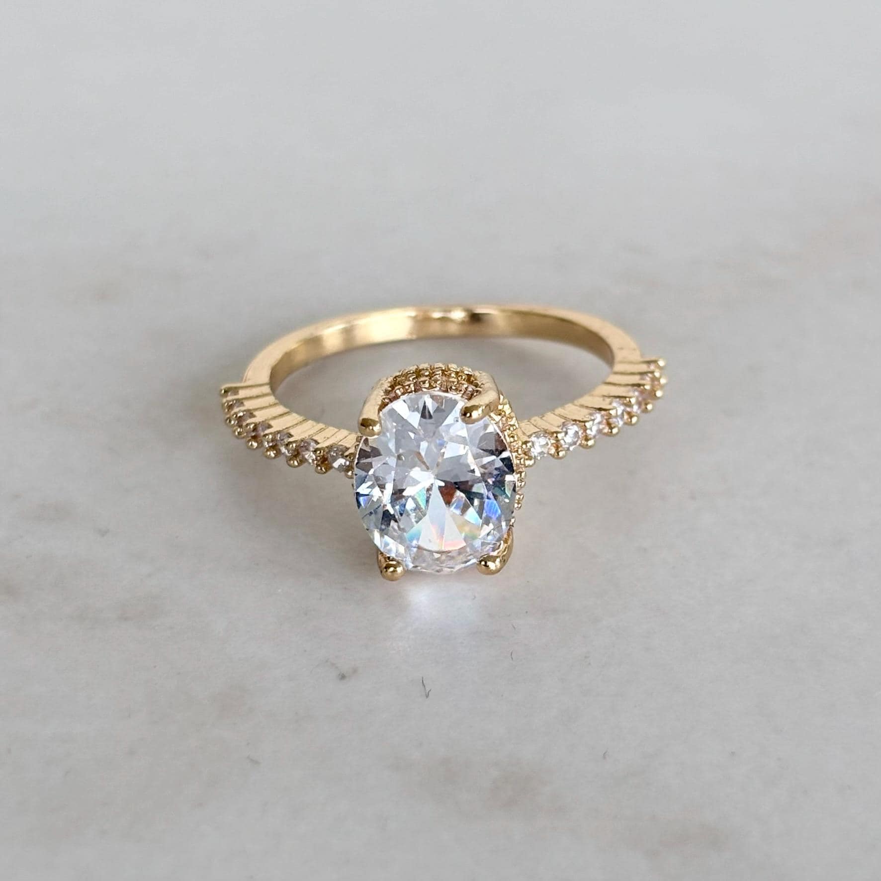 Gold Oval Zircon Solitaire Pave Shoulders Ring